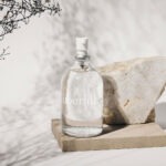 Uberlube - Siliconen Glijmiddel & Massage Flesje 112 ml sfeer
